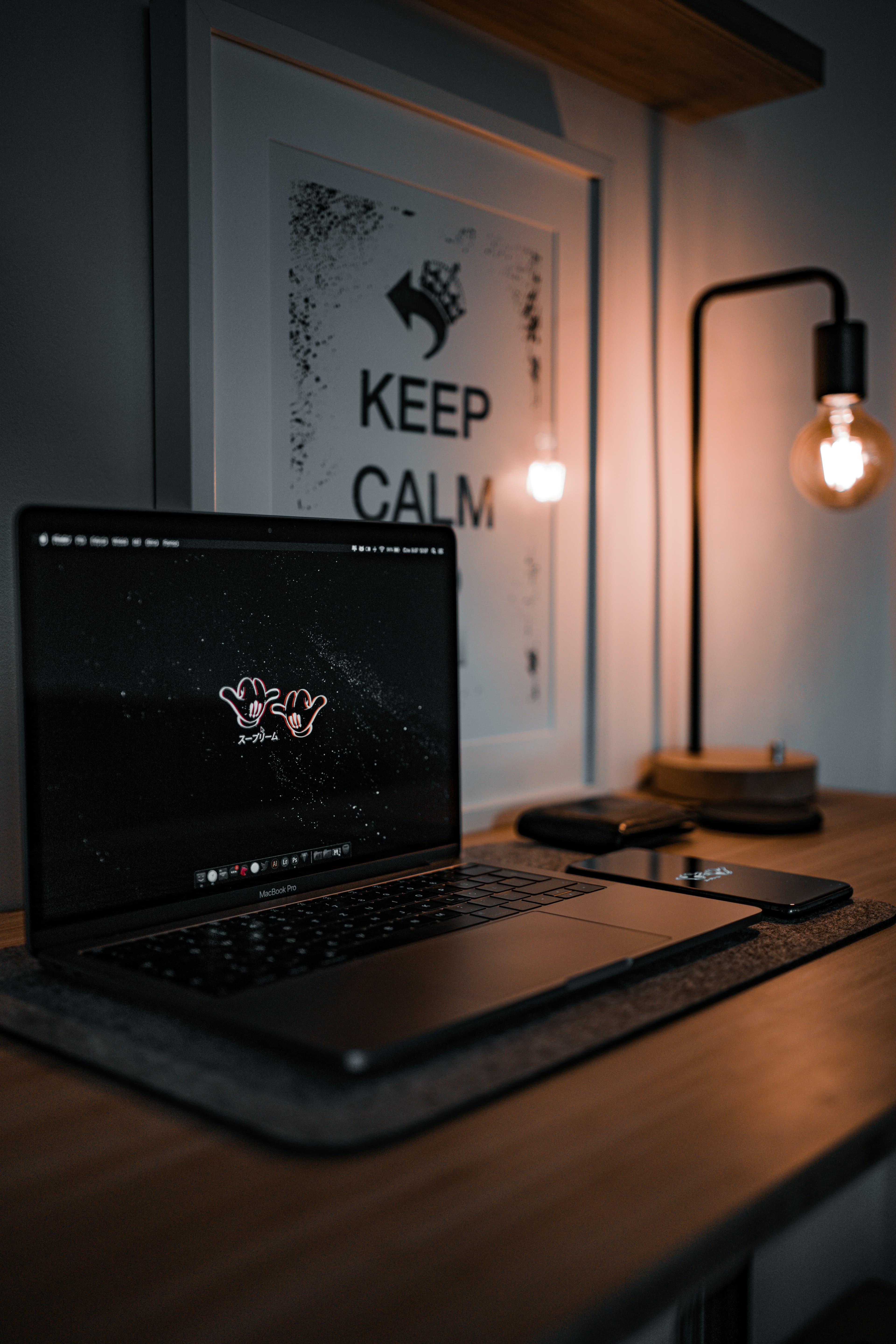 Picture of a warm and comfy studio, with warm lighting and a 'keep calm' text in a picture.